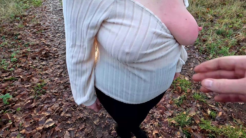 Squeezing her hard naked nipples outdoors
