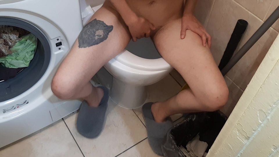 A skinny girl undressed in a public toilet, peed, and masturbated