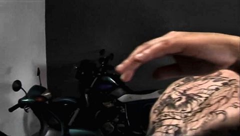 Black chick gives biker head in the garage