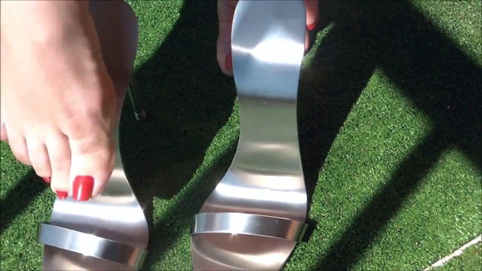 Sexy feet in metal heels 1