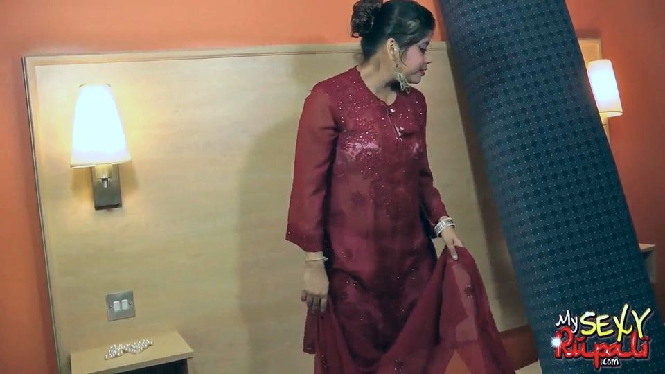 Indian bitch Rupali poses topless laying naked in bed