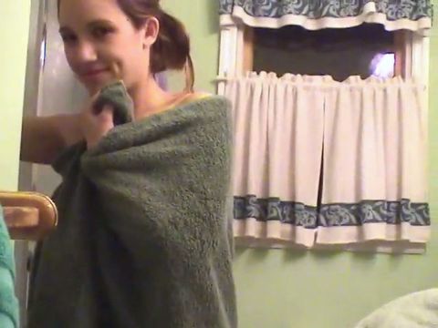 Cute brunette teen soaps up in the shower and takes time to trim her bush