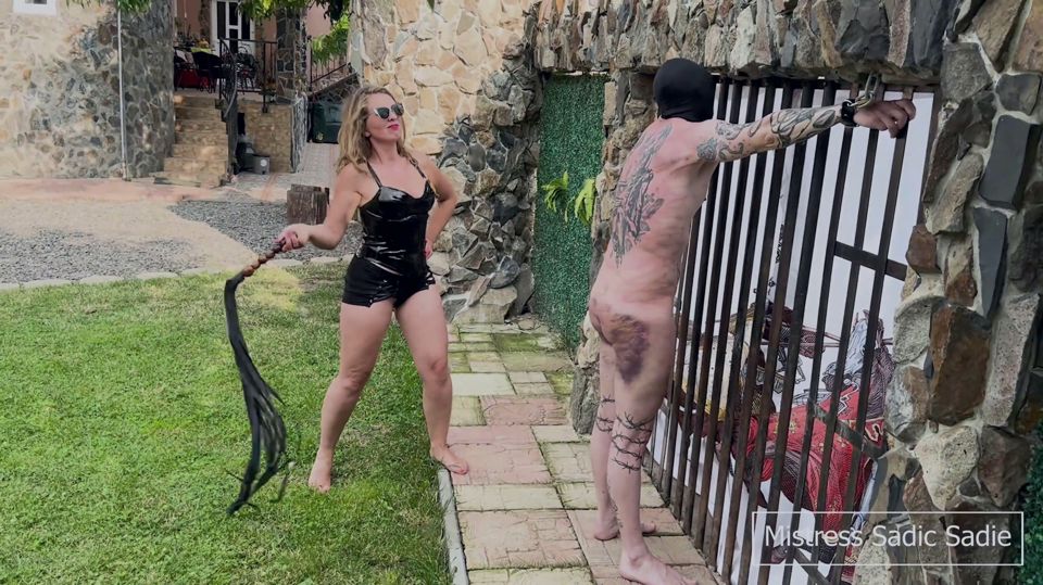 Bruised Slave Getting Whipped by Two Sadists Outside