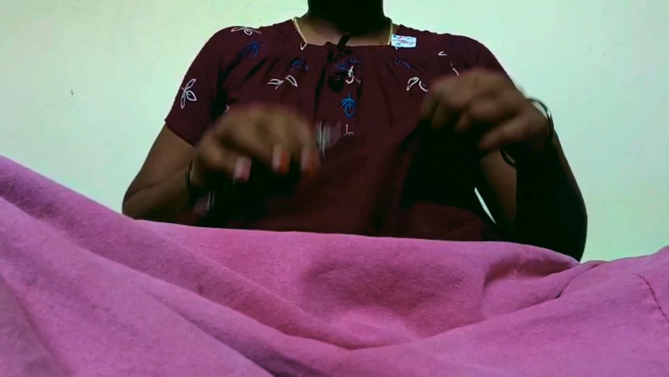 Ammu takes off her nightie and, left in just her undergarments, squeezes her breasts 129