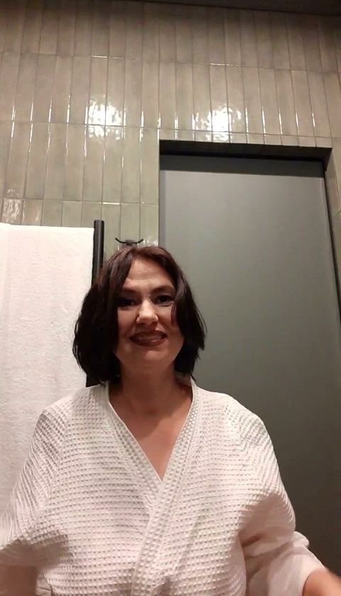 The lady washed in the shower and sat